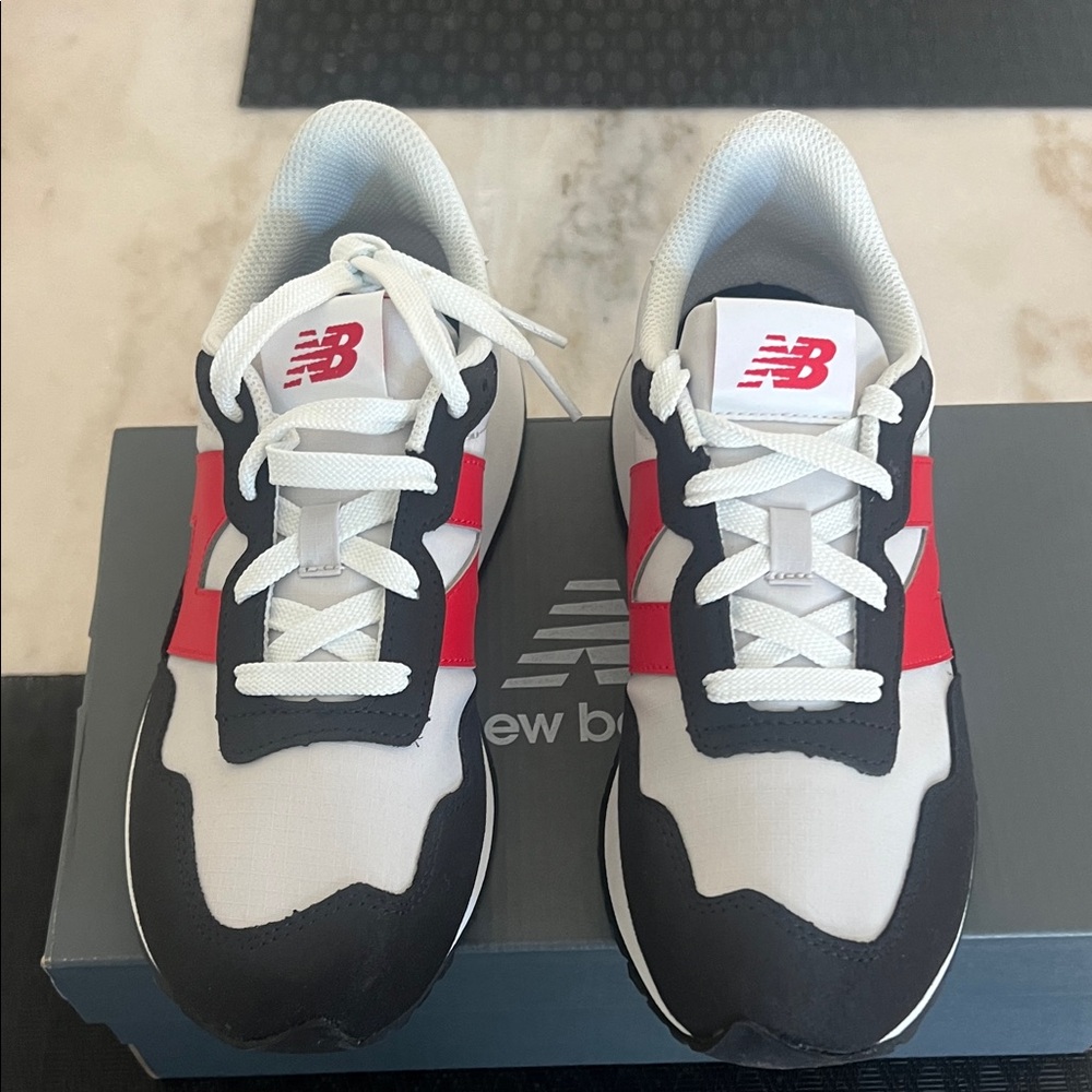 New Balance White and Black Sneakers with Red Accents - Picture 5 of 6